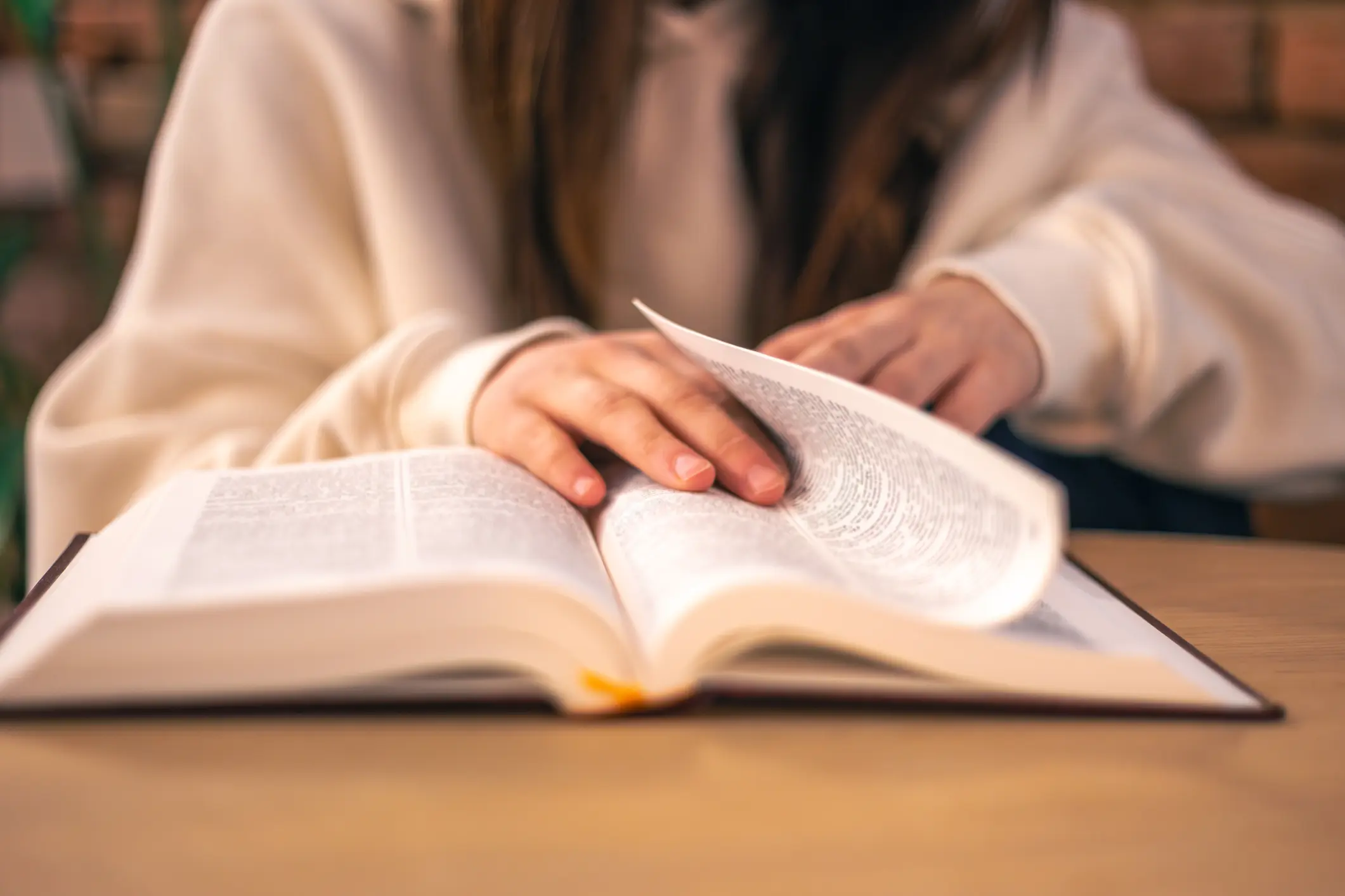 Bible close-up. Christianity concept. Reading the Holy Bible. High quality photo. Reading the Holy Bible, faith, worship, prayer. Bible in women's hands.